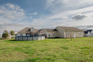 view of yard featuring a covered pool