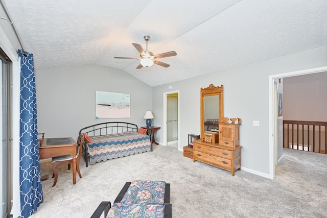 bedroom featuring ceiling fan, carpet, and a textured ceiling