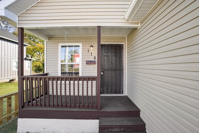 view of exterior entry with covered porch