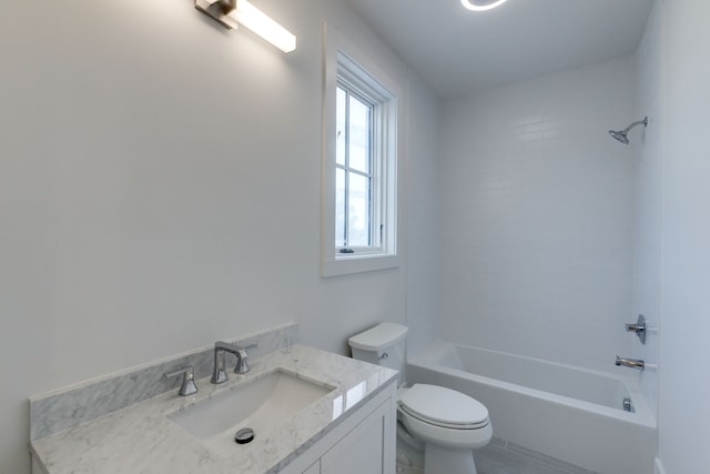 full bathroom with vanity, toilet, and tiled shower / bath