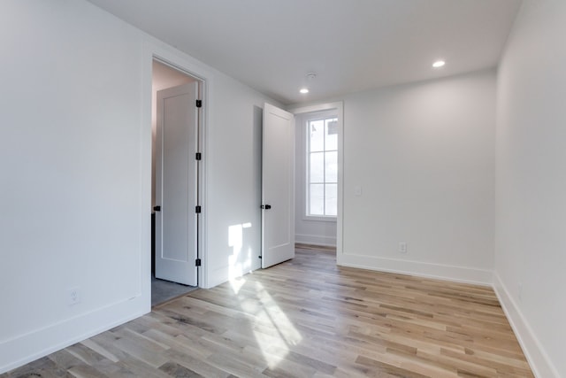 unfurnished room featuring light hardwood / wood-style floors