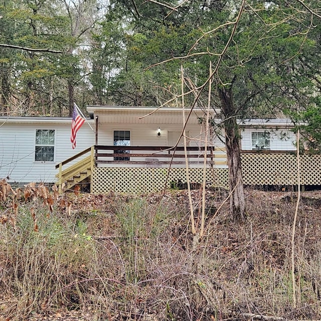 back of property with a deck