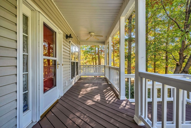 wooden deck featuring ceiling fan and covered porch