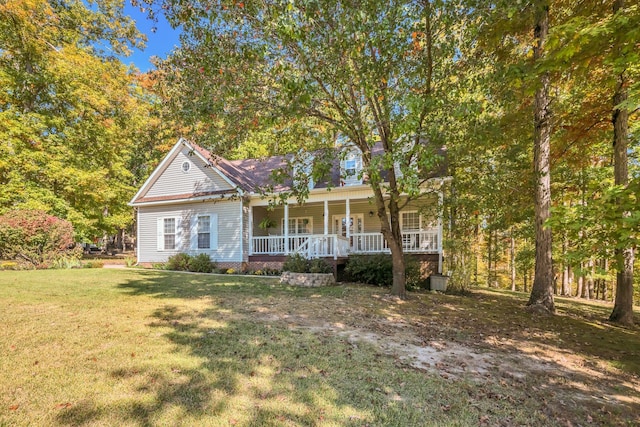 view of front facade with a front yard and a porch