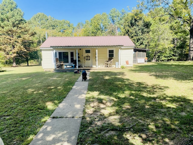 view of front of home with a front lawn and covered porch