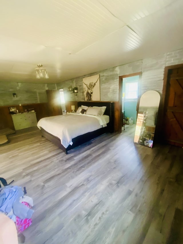 unfurnished bedroom with hardwood / wood-style flooring