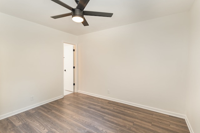 unfurnished room with dark wood-type flooring and ceiling fan