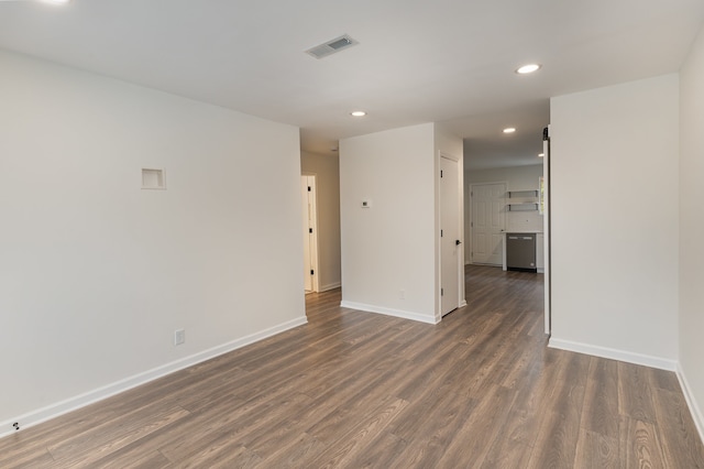 spare room with dark hardwood / wood-style flooring