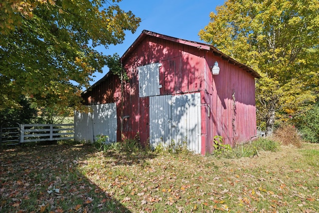 view of outbuilding featuring a yard