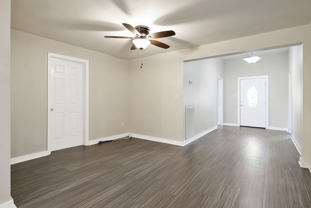 foyer with dark wood-type flooring and ceiling fan