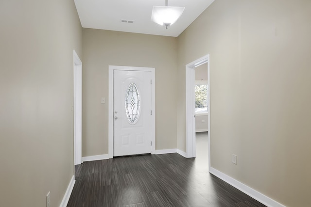 foyer with dark hardwood / wood-style flooring