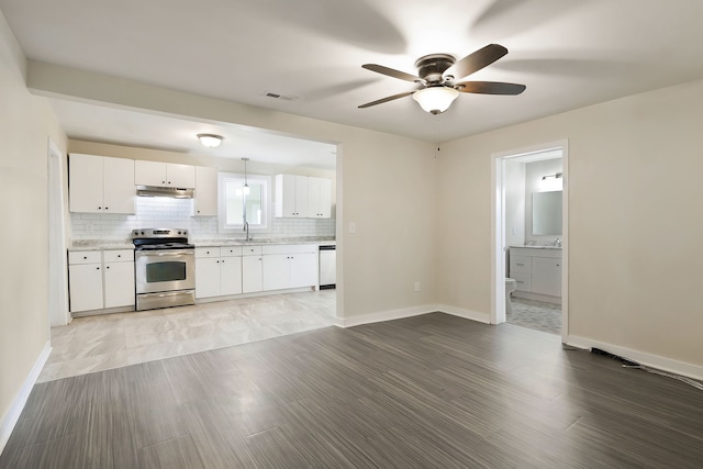 kitchen with white cabinets, dishwasher, sink, and stainless steel range with electric cooktop