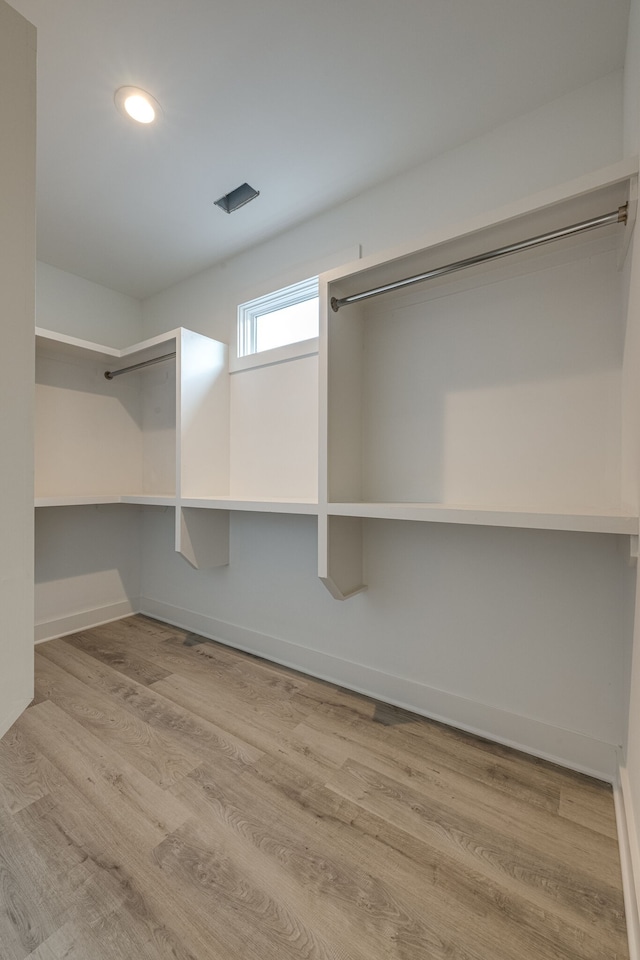 spacious closet featuring light wood-type flooring