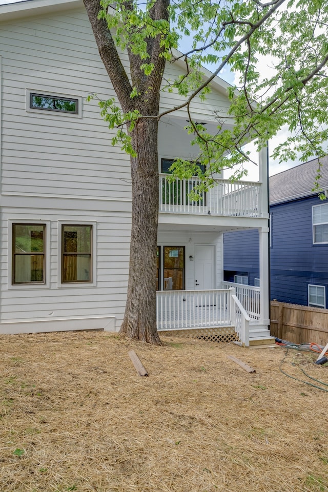 rear view of house with a balcony