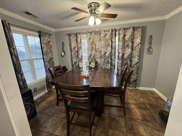 dining area with crown molding, a textured ceiling, a healthy amount of sunlight, and ceiling fan