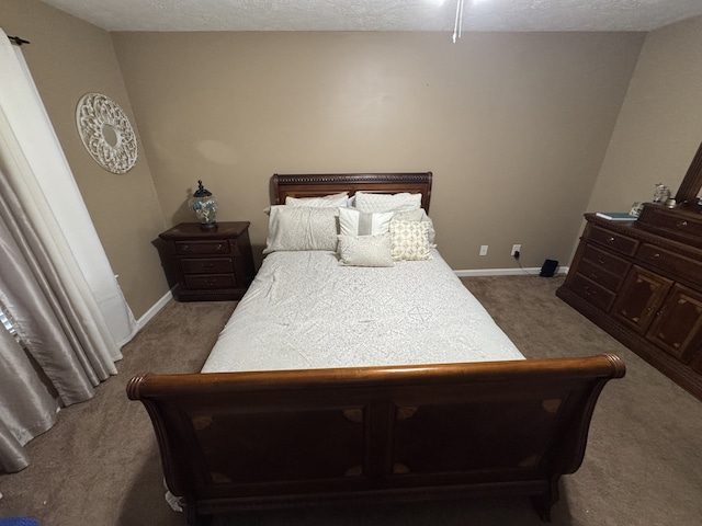 carpeted bedroom with a textured ceiling