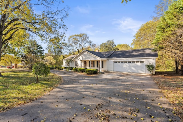 view of front facade with a front lawn and a garage