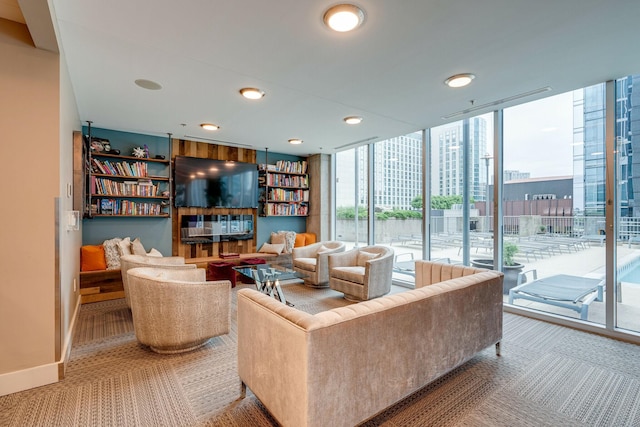 carpeted living room featuring expansive windows