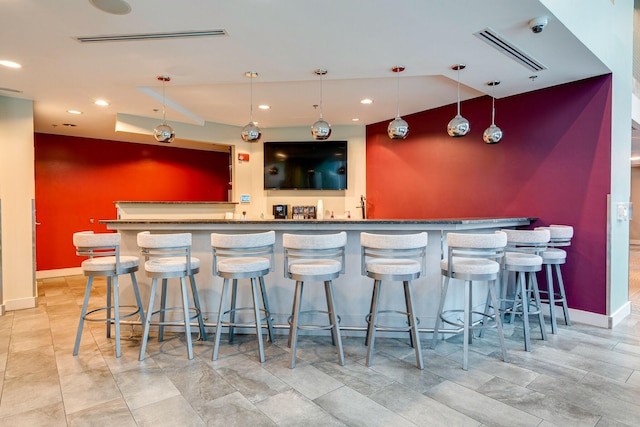 bar featuring decorative light fixtures