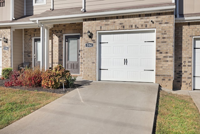 view of exterior entry featuring a garage