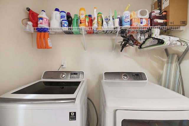 laundry room featuring separate washer and dryer