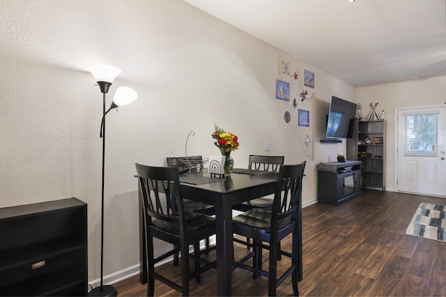 dining room featuring dark wood-type flooring