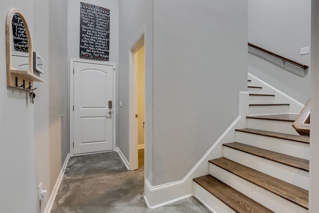 stairway with concrete floors