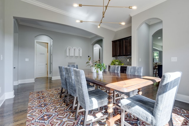 dining room featuring ornamental molding and dark wood-type flooring