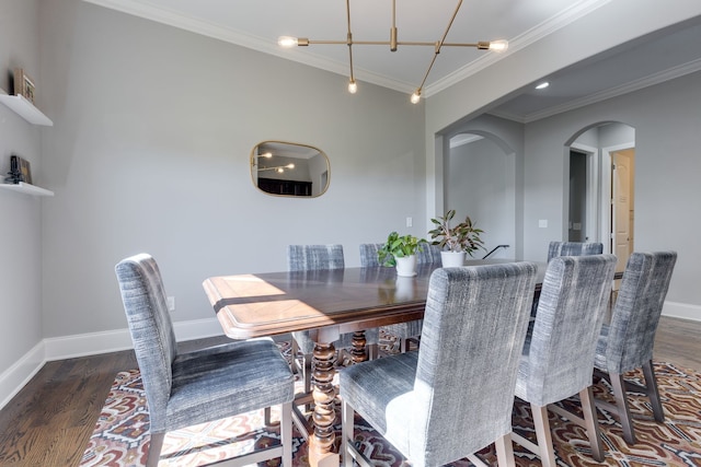 dining space with dark wood-type flooring and ornamental molding