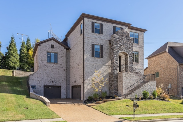 view of front of home with a front yard and a garage