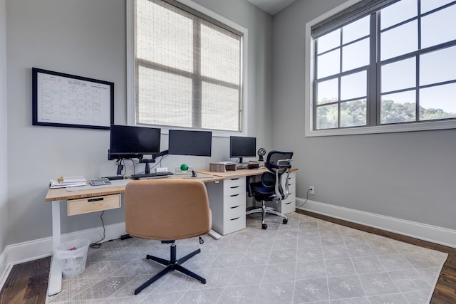 office area with light hardwood / wood-style floors