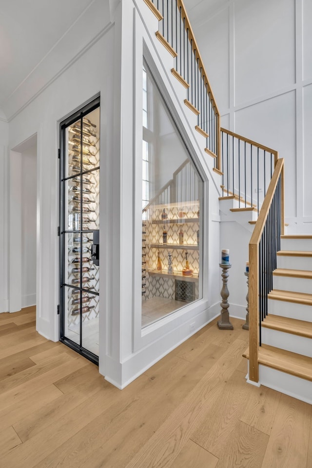 staircase with wood-type flooring