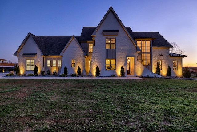 view of front of house with a yard