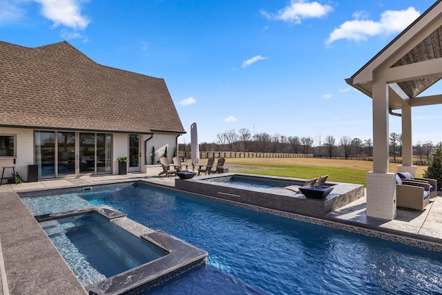 view of pool with a patio, an outdoor living space, an in ground hot tub, and a lawn