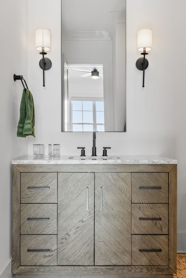 bathroom with vanity and crown molding