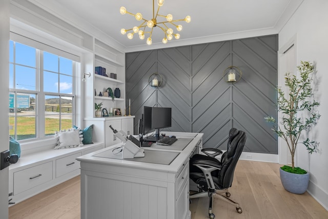 home office featuring a wealth of natural light, ornamental molding, and light wood-type flooring