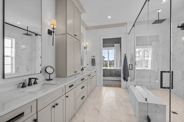 bathroom with vanity and a shower with shower door