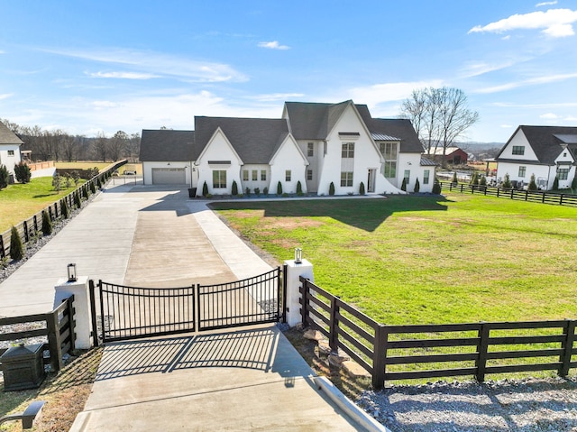 view of front of property featuring a front lawn and a garage