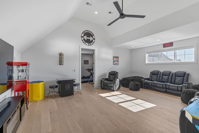 living room with light hardwood / wood-style flooring, high vaulted ceiling, and ceiling fan