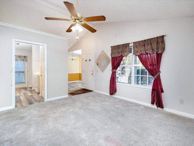 interior space with ceiling fan, lofted ceiling, and carpet floors