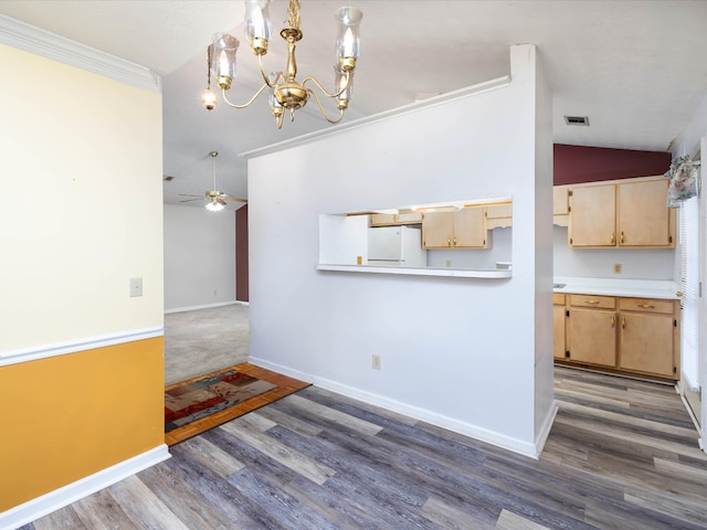 interior space featuring crown molding, vaulted ceiling, ceiling fan, and dark hardwood / wood-style flooring