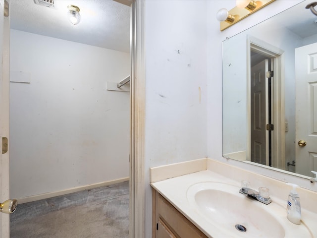 bathroom with vanity and a textured ceiling