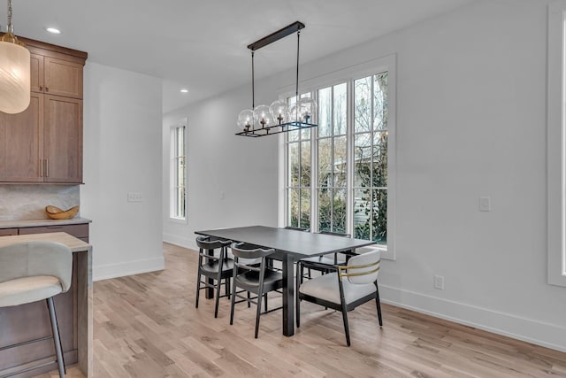 dining room featuring a chandelier and light hardwood / wood-style floors