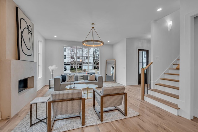 living room featuring a fireplace and light hardwood / wood-style floors