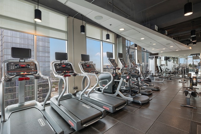 workout area featuring expansive windows