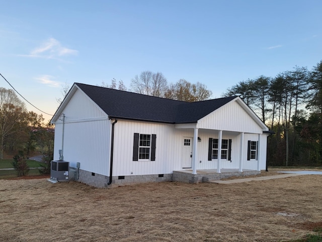 modern farmhouse featuring cooling unit and a porch