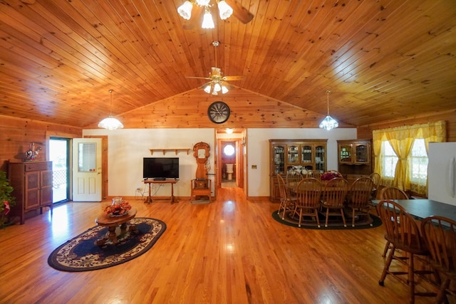 living room with wood ceiling, hardwood / wood-style floors, a healthy amount of sunlight, and ceiling fan