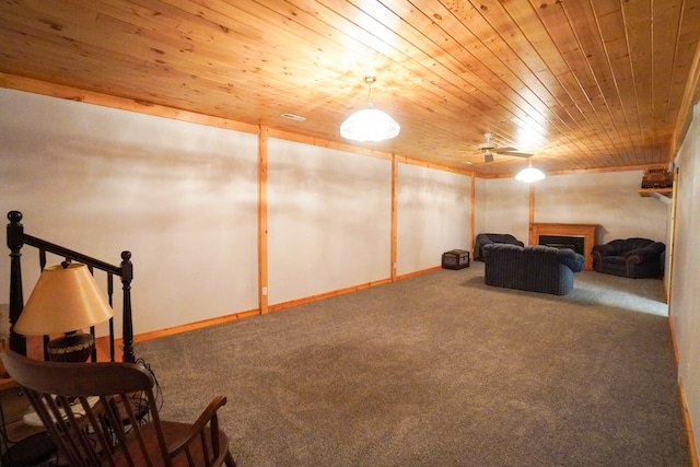 living area featuring carpet floors and wooden ceiling