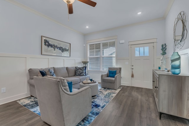 living room featuring ceiling fan, dark wood-type flooring, and ornamental molding