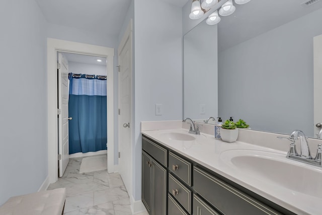 bathroom featuring vanity and curtained shower